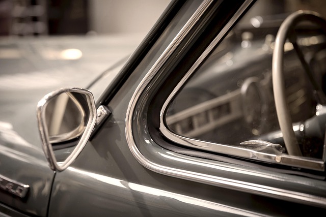 Close-up of a vintage car's headlight, emphasizing classic design and intricate details.